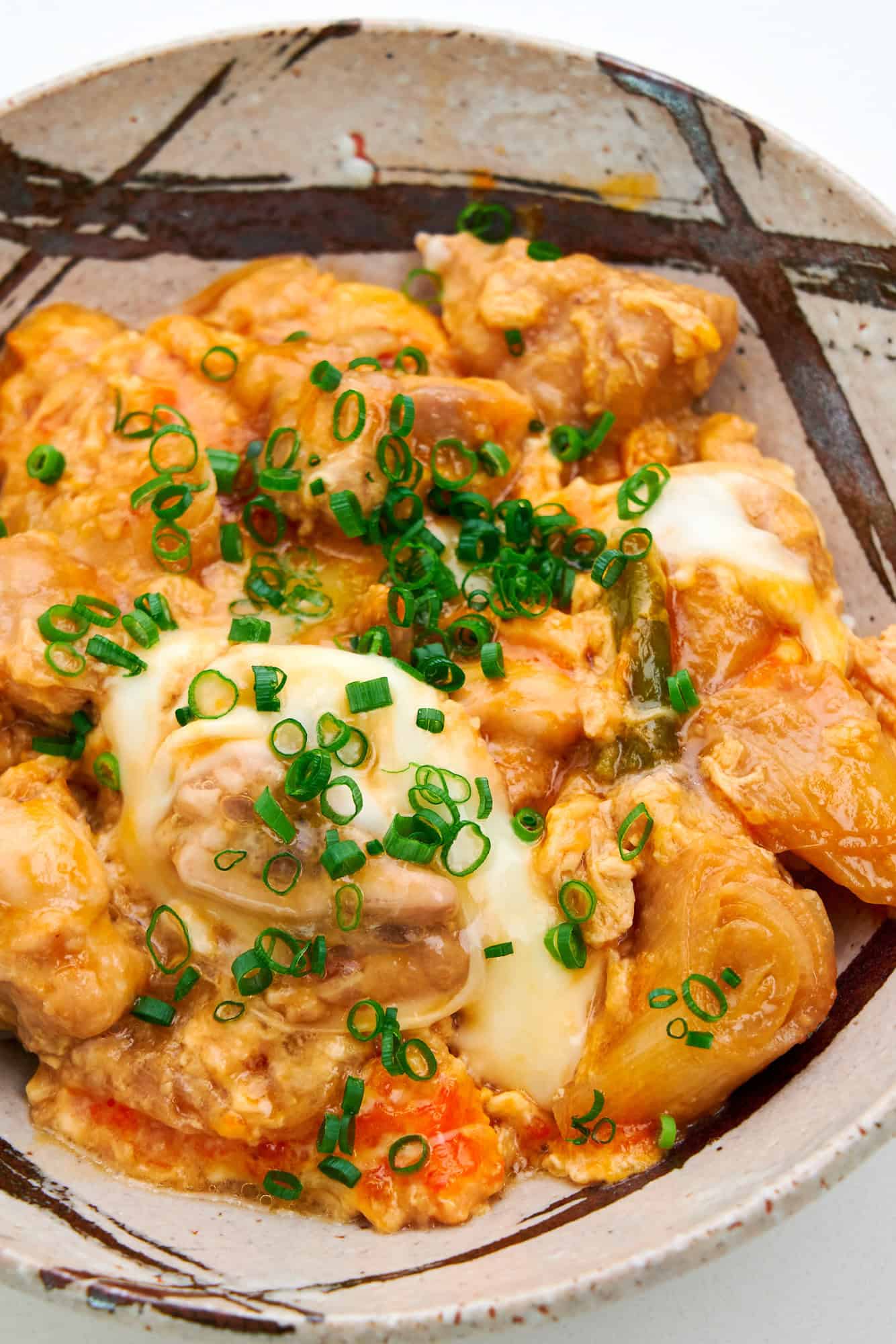 Close up view of Oyakodon chicken and egg bowl amped up with an addition of miso.