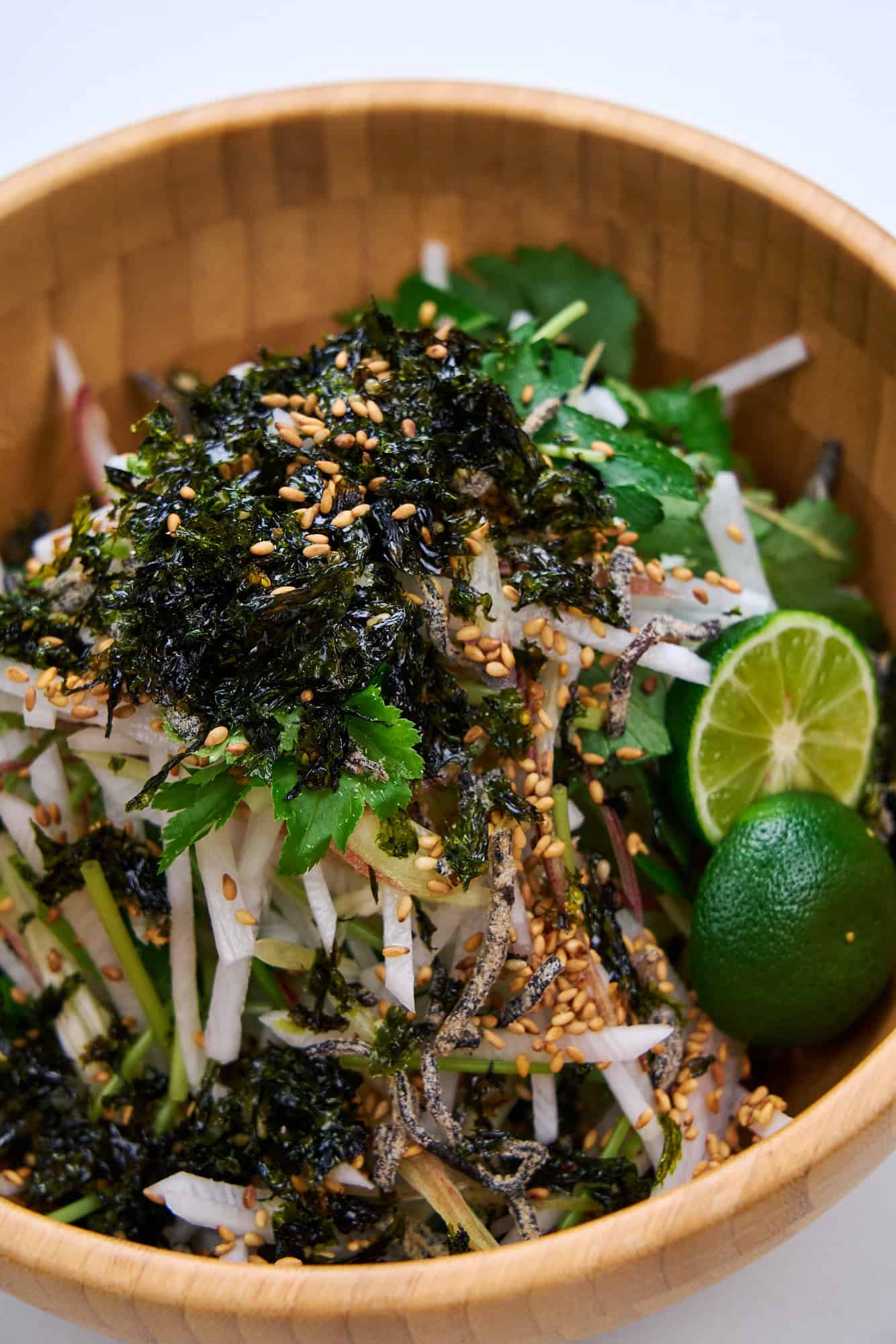 Close image of daikon and herb salad with citrus.