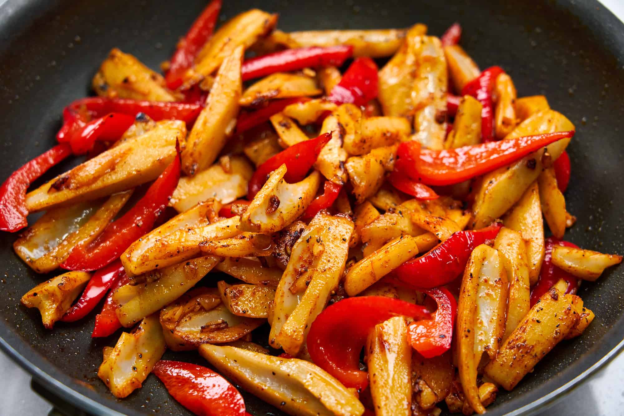 Crisp spears of lotus root join sweet, juicy red peppers in garlicky olive oil.