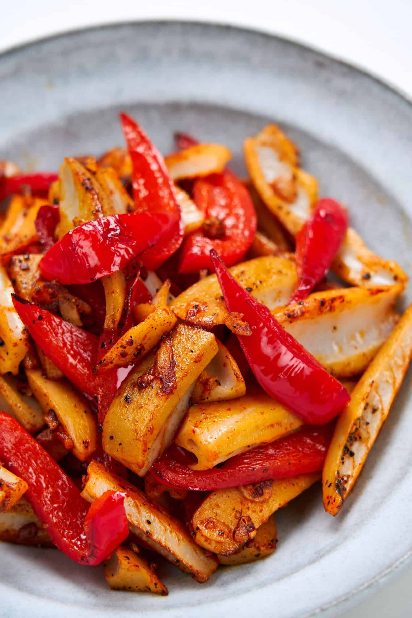 Crisp spears of lotus root join sweet, juicy red peppers in garlicky olive oil.