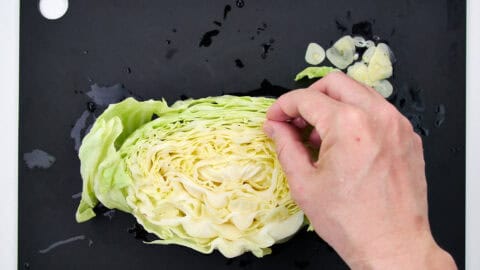 Tucking slices of garlic away in the leaves adds flavor.