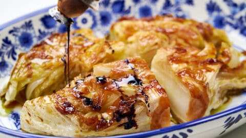 Crispy, golden pan fried cabbage steak ready to serve.