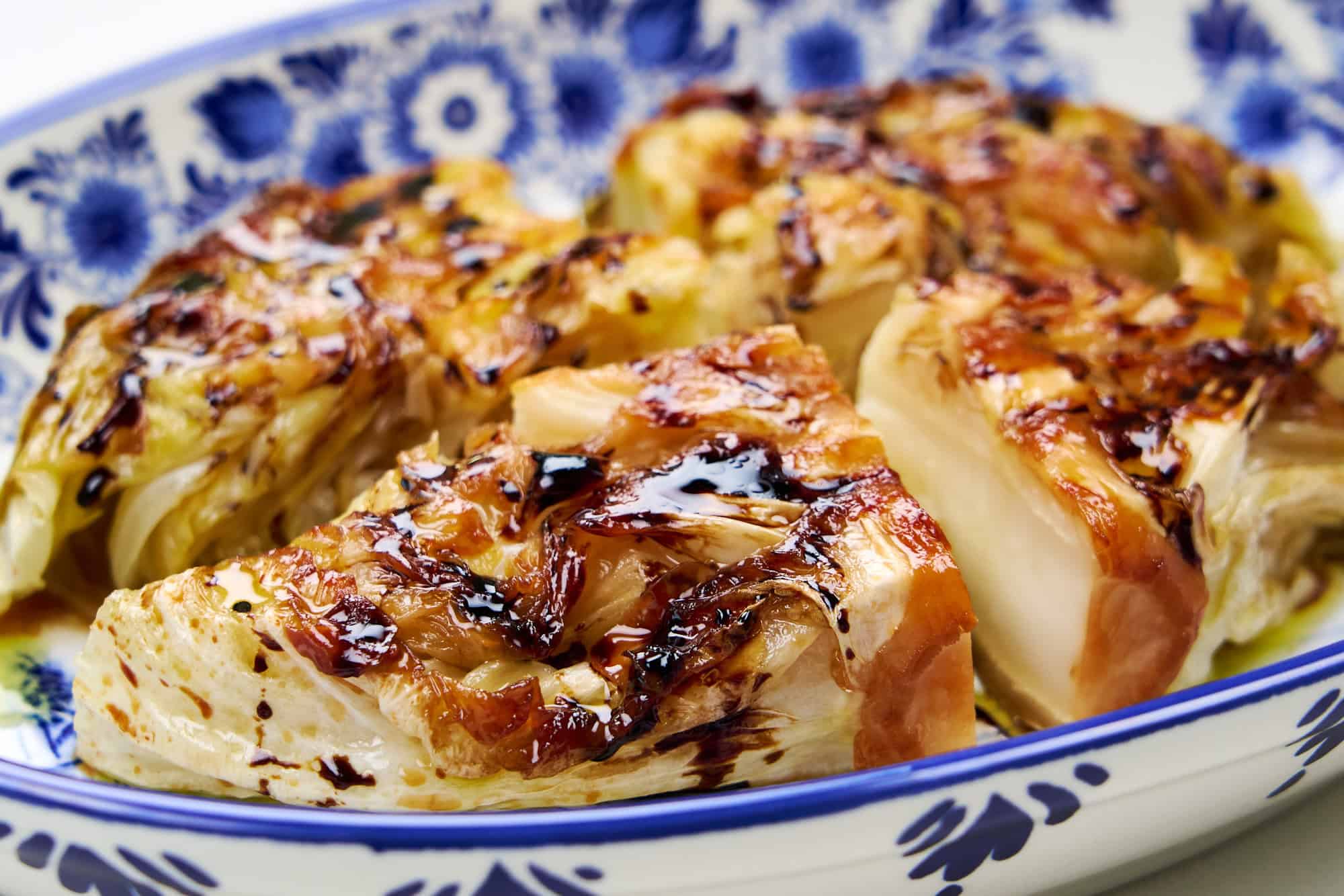Crispy, golden pan fried cabbage steak ready to serve.