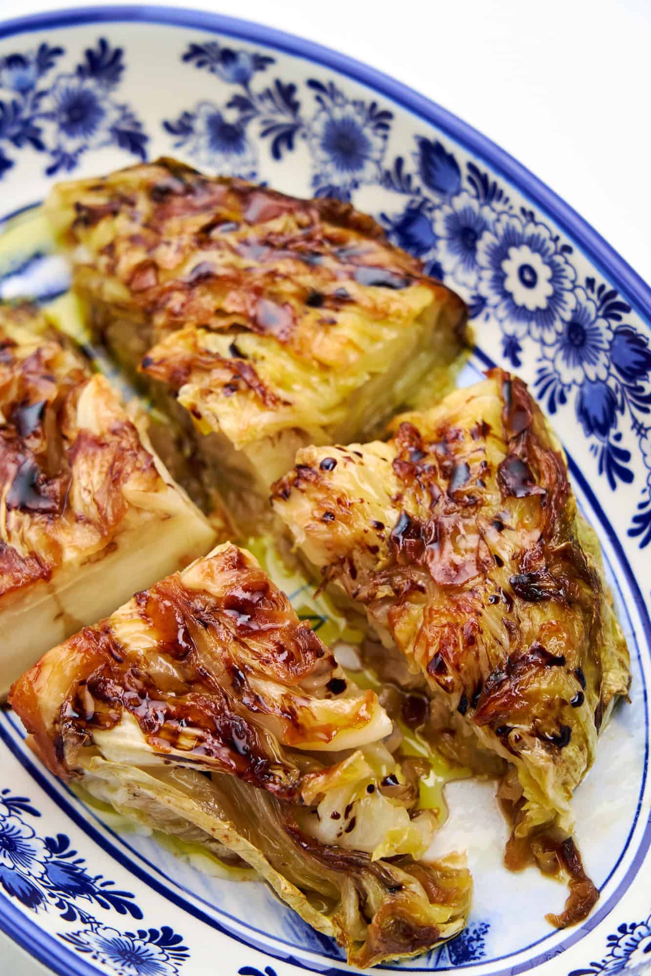 Crispy, golden pan fried cabbage steak ready to serve.