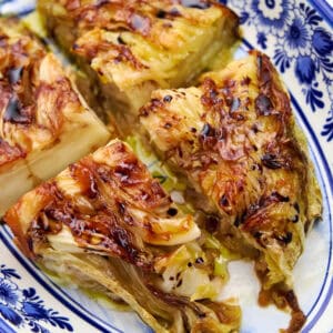 Crispy, golden pan fried cabbage steak ready to serve.