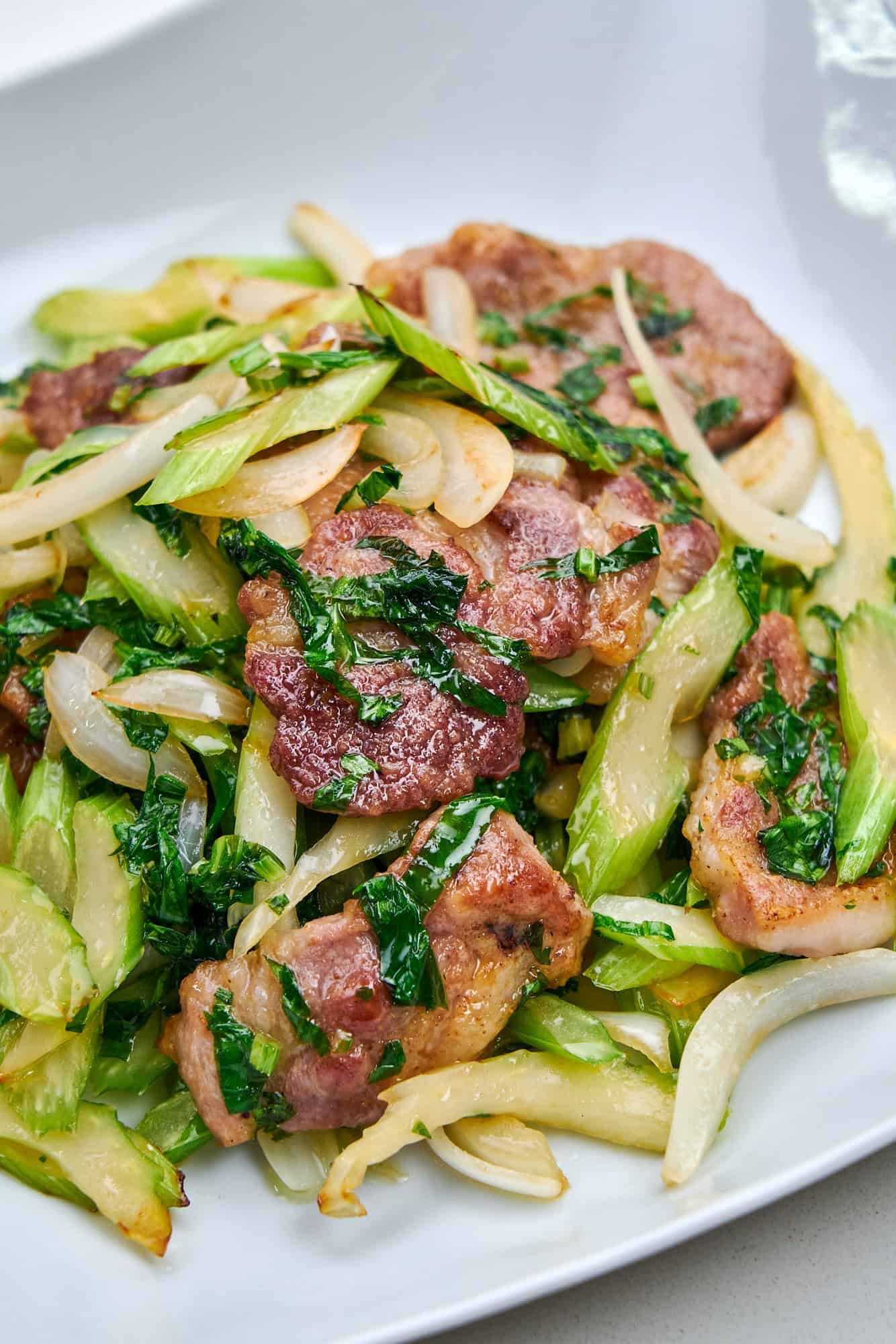 Pork and Celery Stir Fry on a white plate.