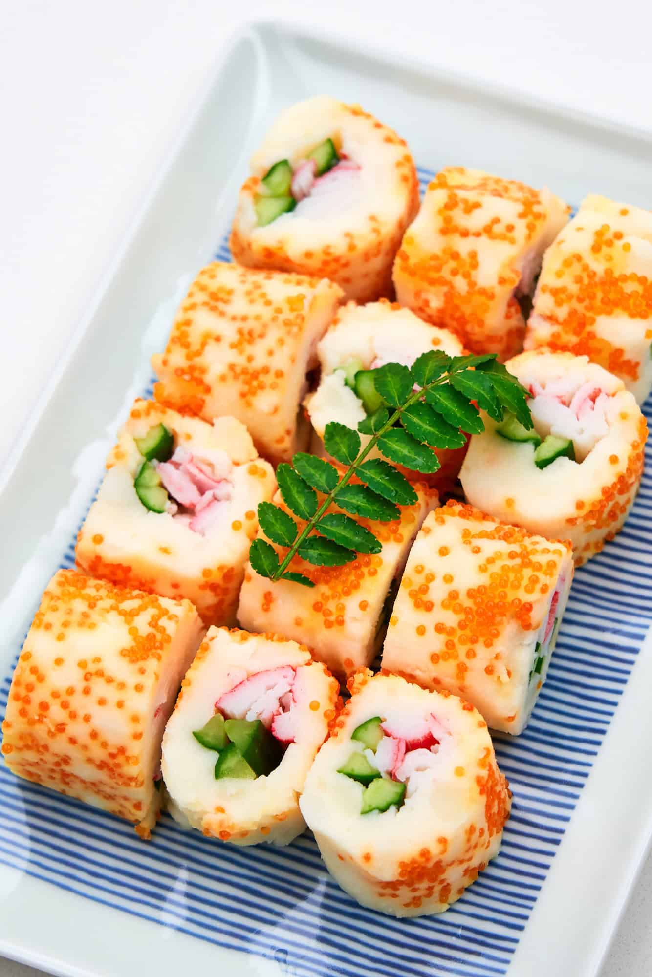 Rolls made with mashed potato and filled with vegetables and imitation crab, then rolled in fish eggs.