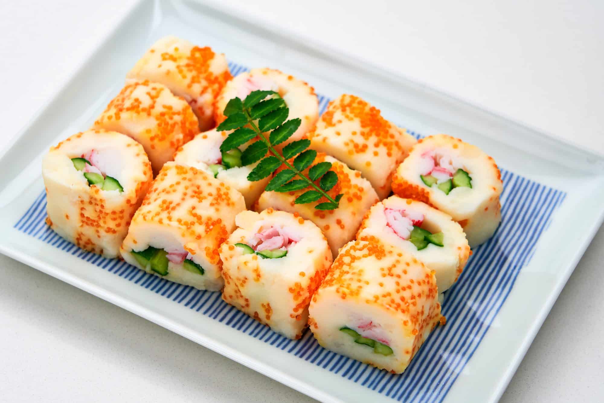 Rolls made with mashed potato and filled with vegetables and imitation crab, then rolled in fish eggs.