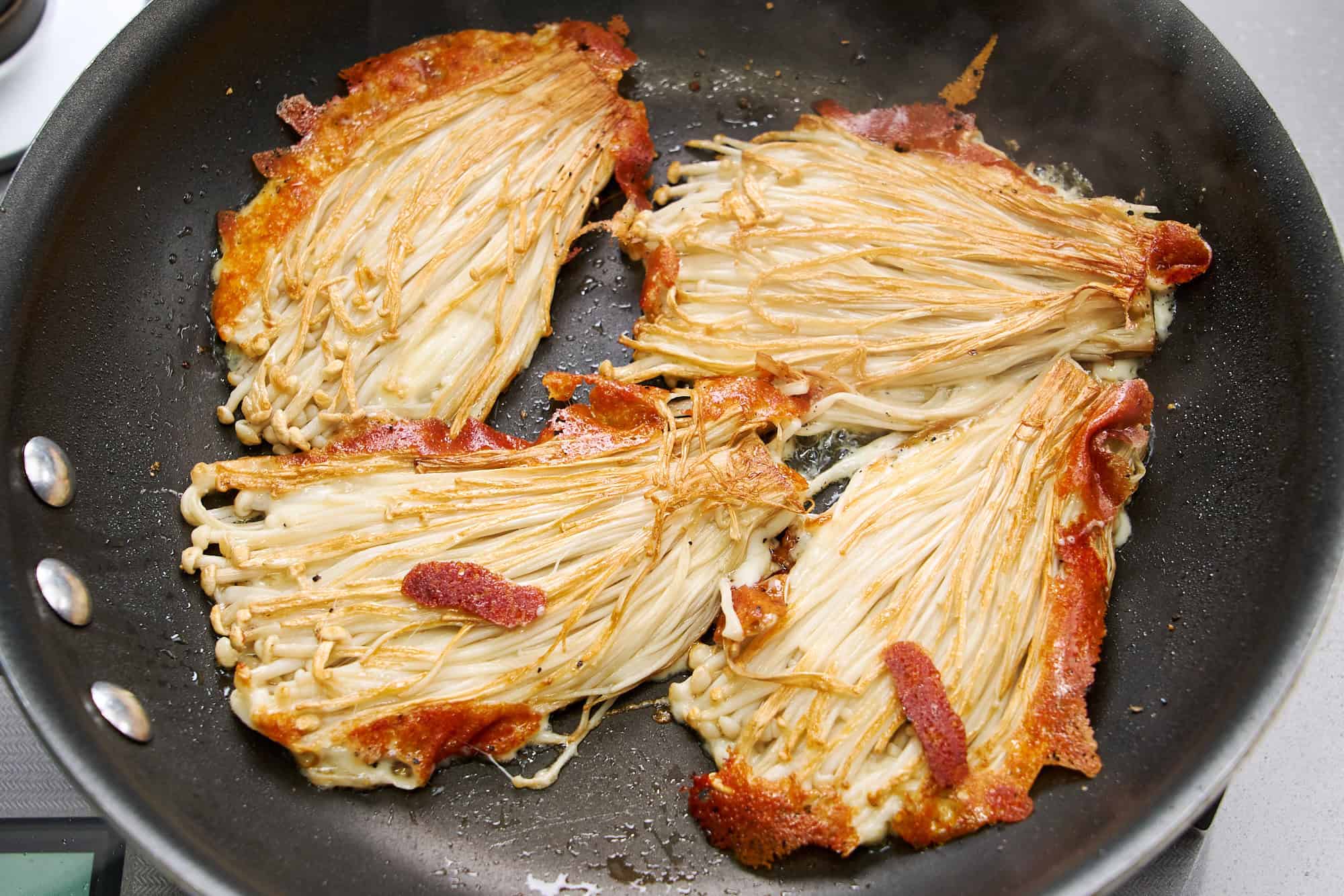 Enoki and cheese fried until crispy.