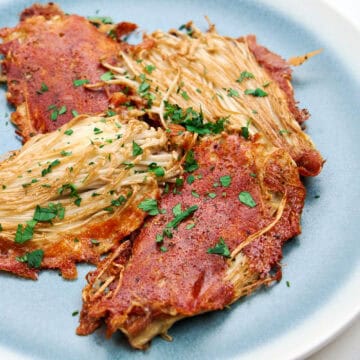 A plate of delightfully crispy enoki cheese fritters.