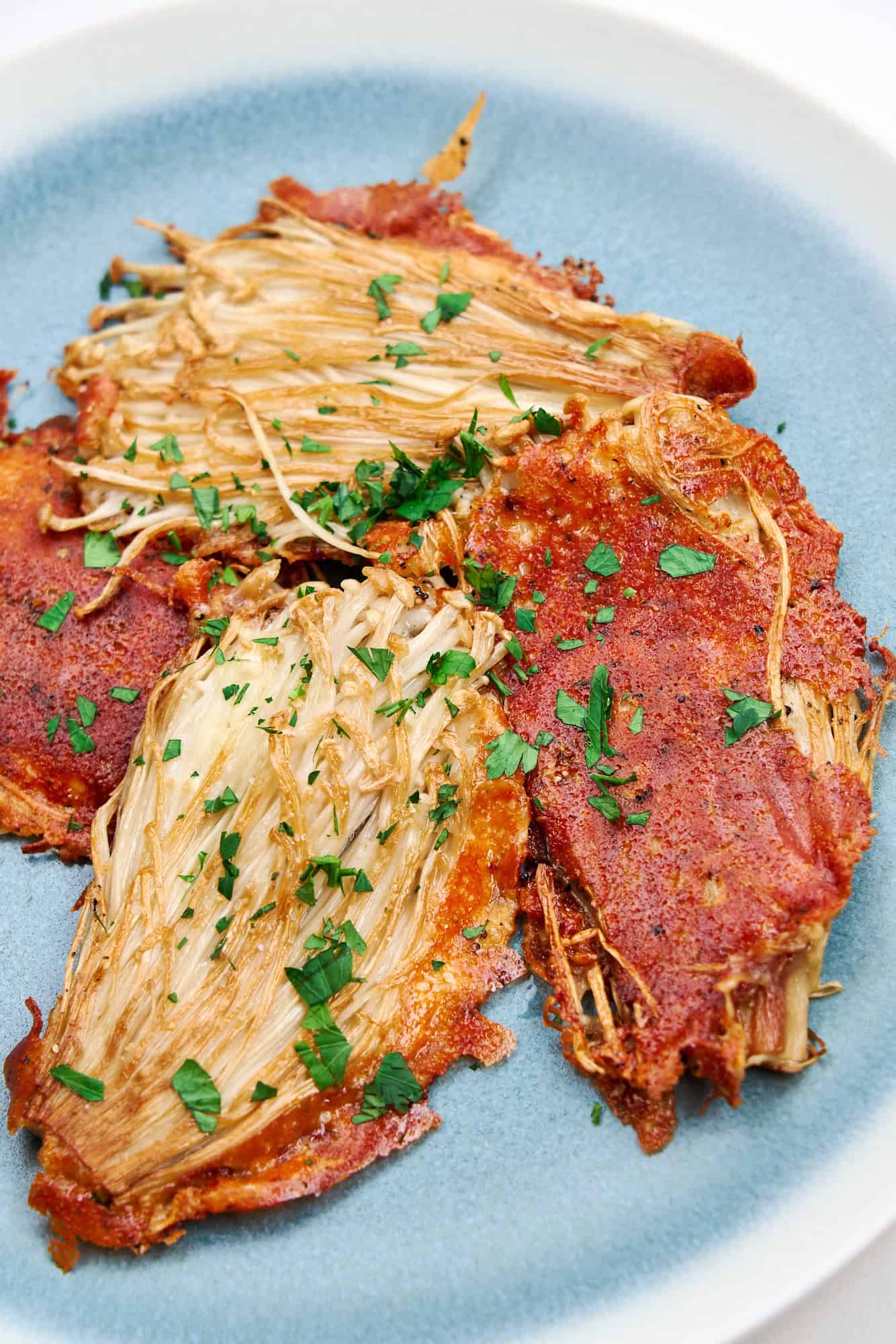 A plate of delightfully crispy enoki cheese fritters.