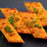 Golden baked slices of mala garlic bread ready to devour.