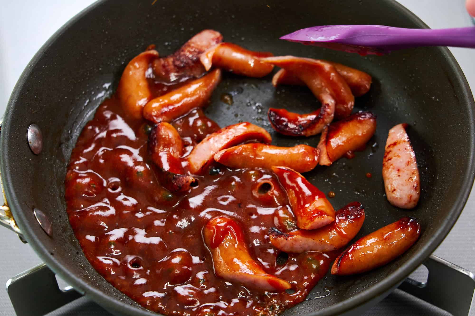 Glazing the sausages.