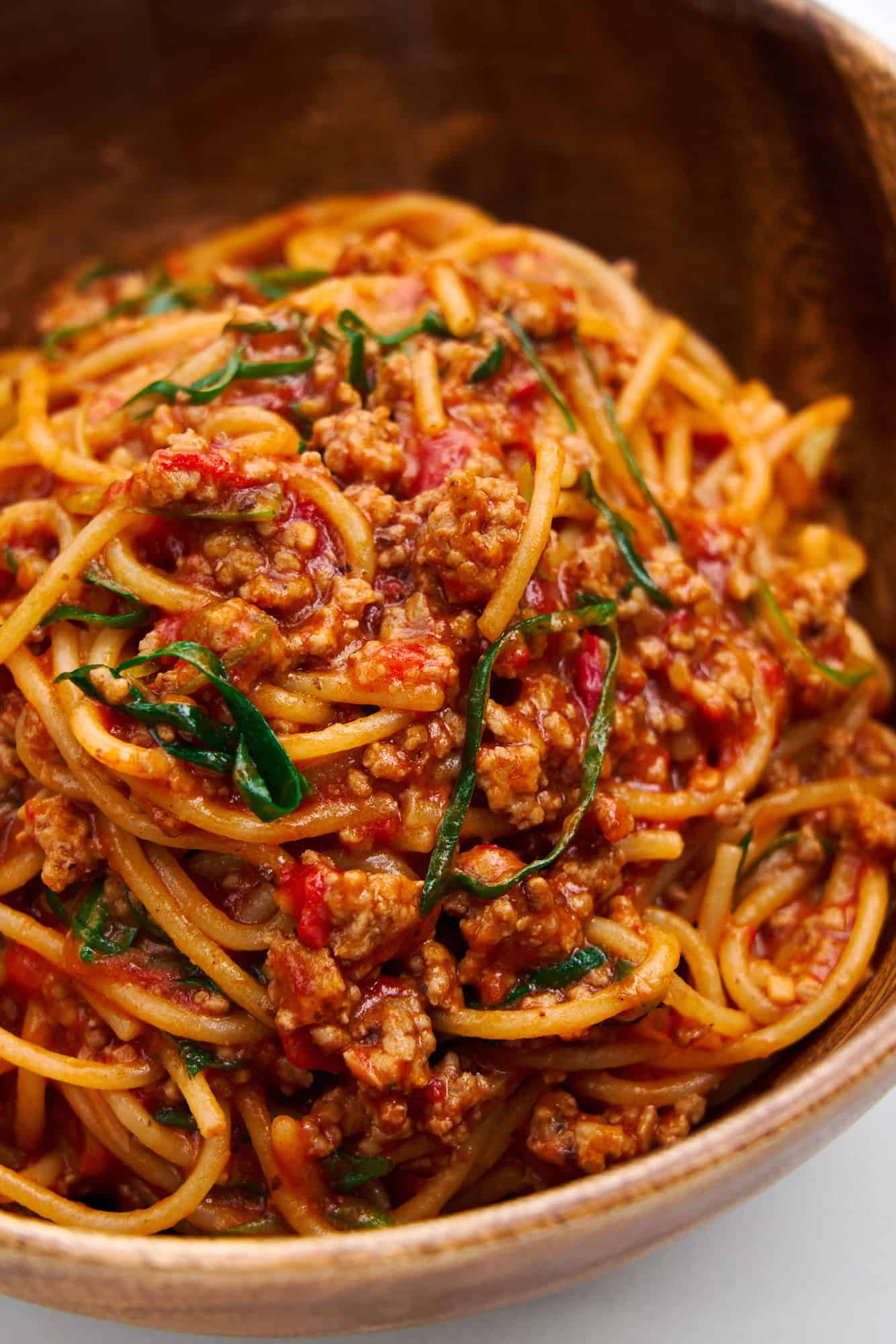 Sichuan Speghetti in a wooden bowl.