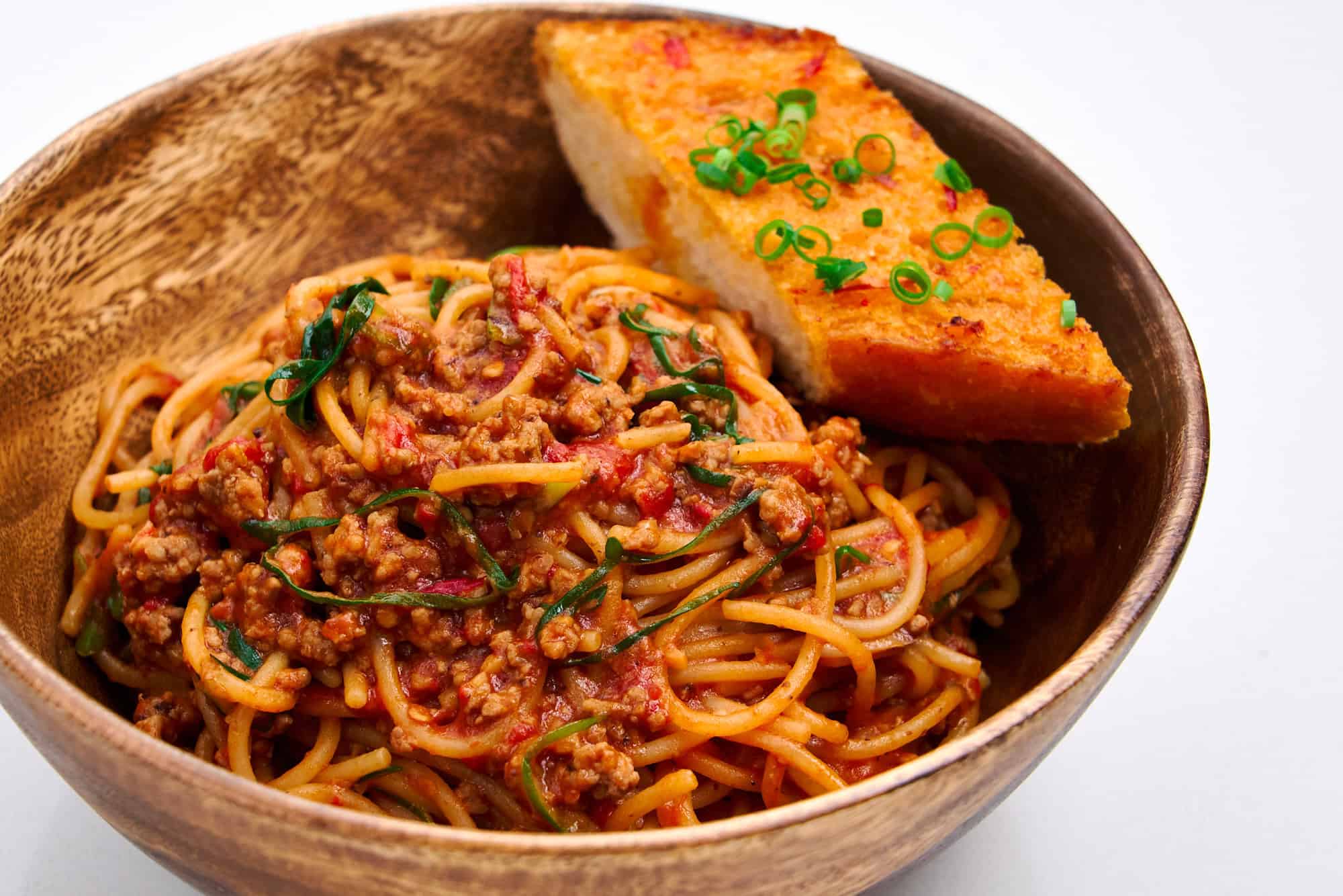 Sichuan spaghetti served with mala garlic bread.