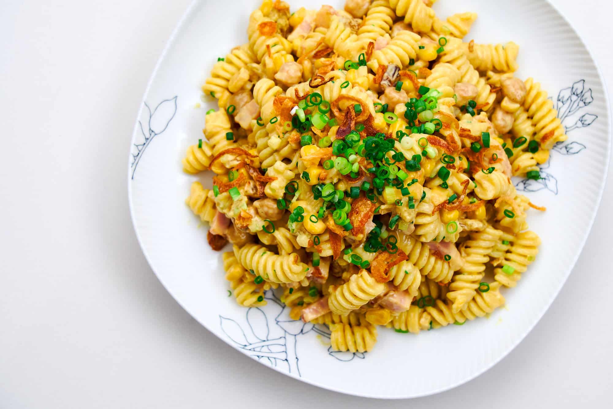 A plate piled high with Curry Pasta Salad.
