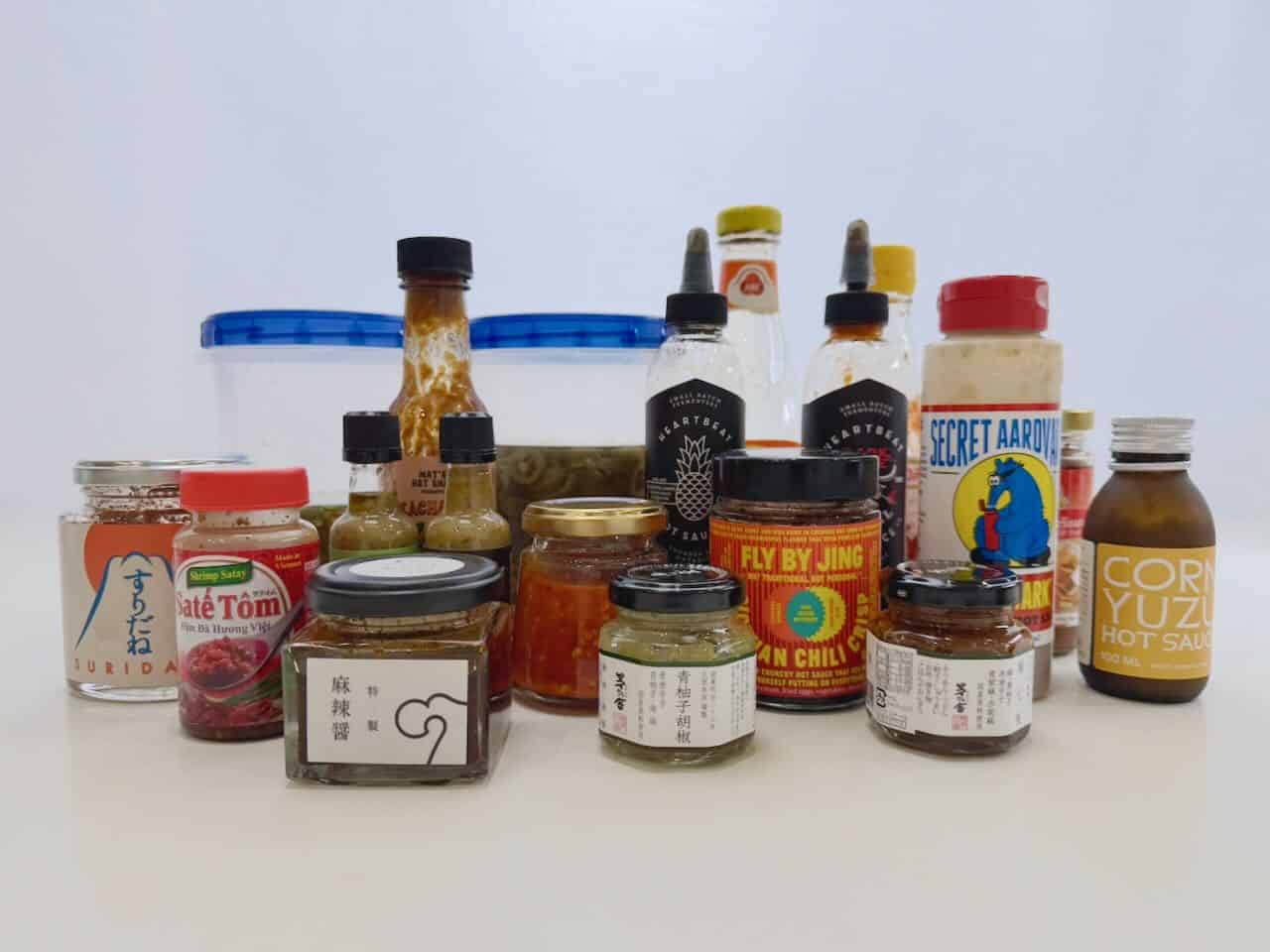 Jars and bottles of hot sauces.