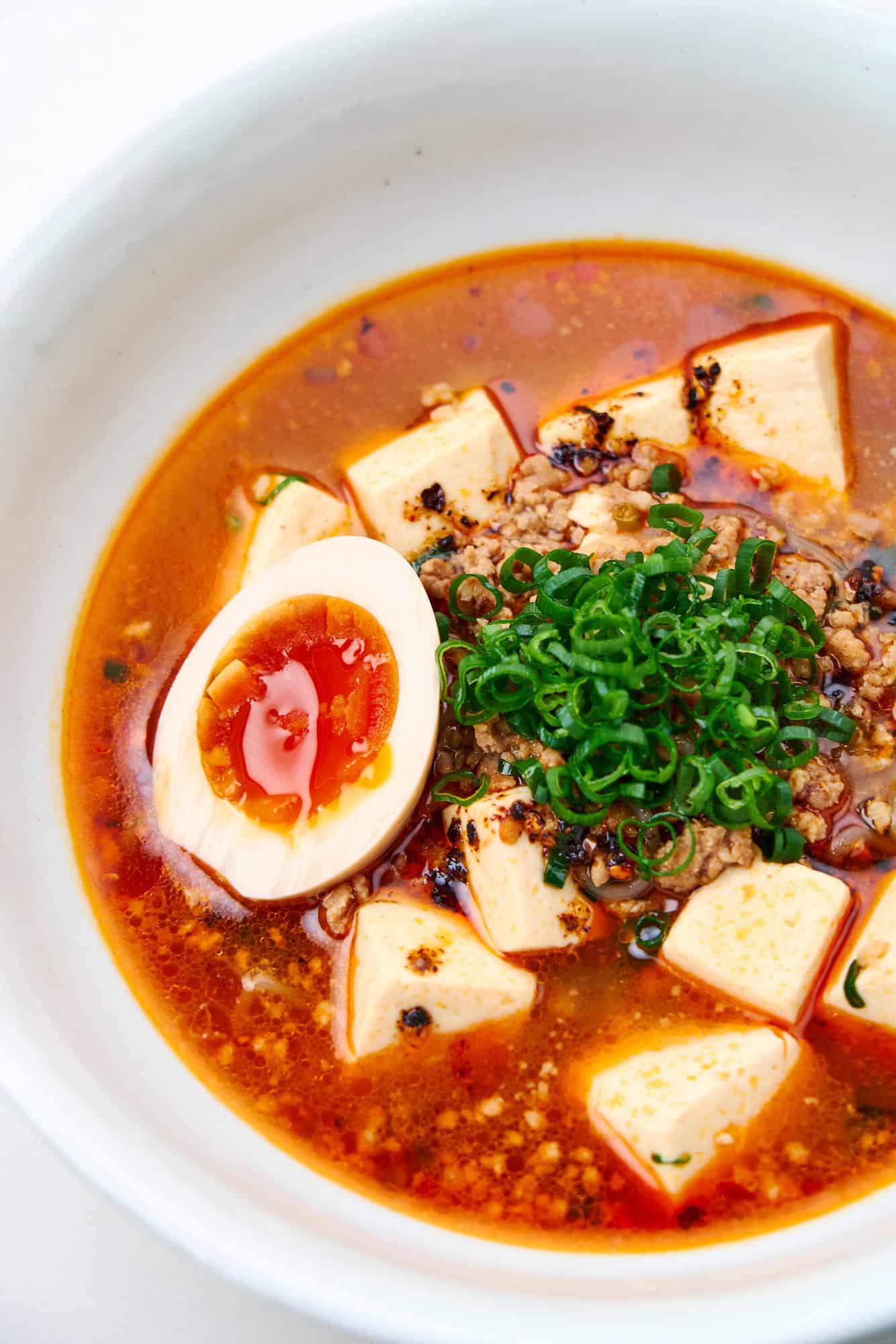 Spicy Mapo Tofu Noodle Soup with a ramen egg.